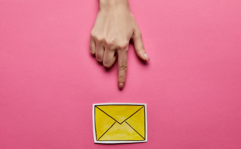 pointing at yellow envelop